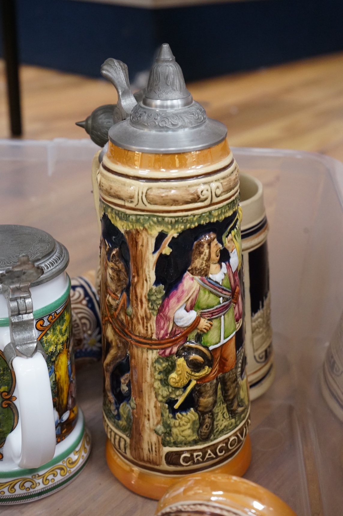 A collection of German ale steins and an Imari seated cat-37cm high